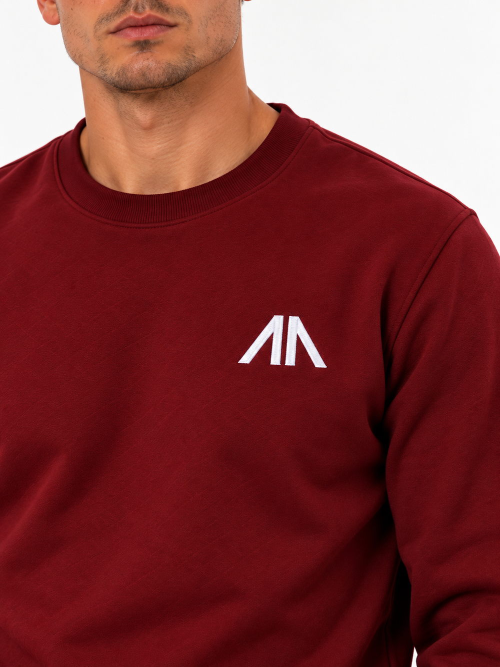 Close-up geborduurd Affinia logo op de borst